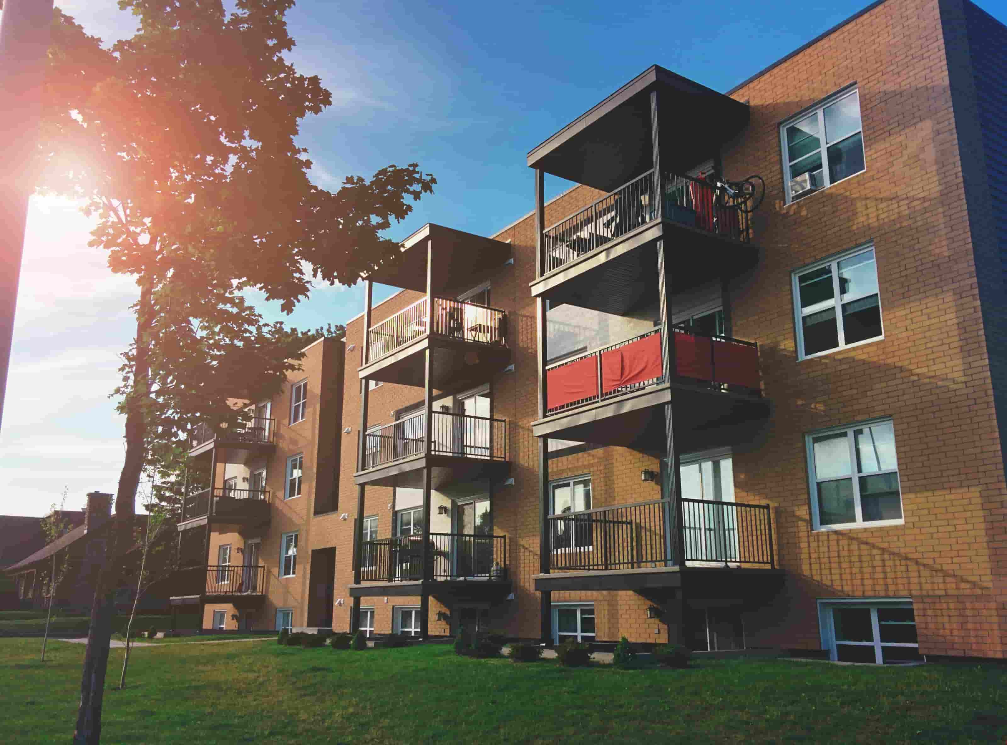 Exterior view of a multi-story brick apartment building