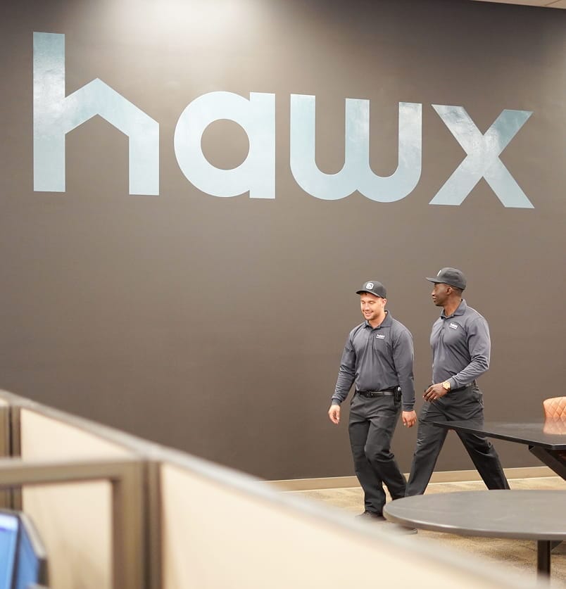 Two Hawx employees walking in the Hawx office