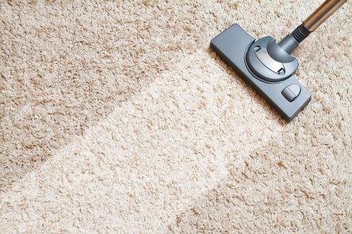 tan carpet is vacuumed